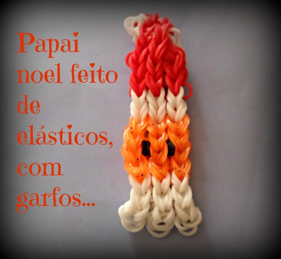 Papai noel de elásticos,feito com garfos. .