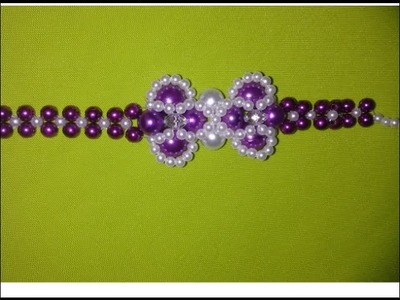 Como fazer pulseira de pérolas flor violeta