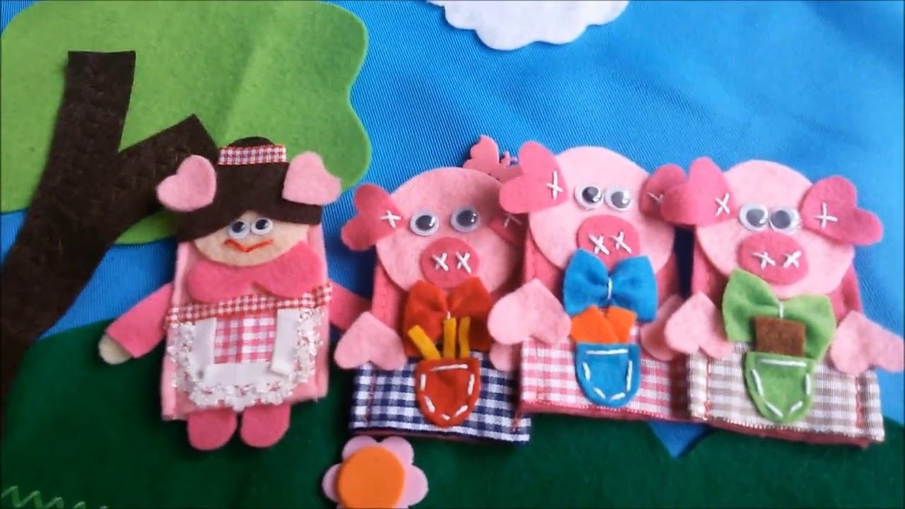 História d' "Os 3 Porquinhos", em avental com dedoches