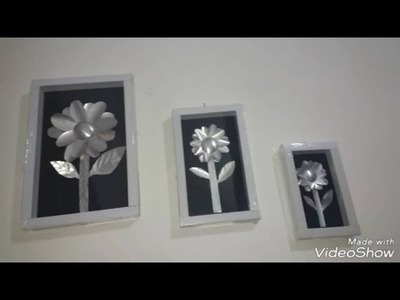 Conjunto de quadro feito com cano PVC e flor de girassol feito com latinha