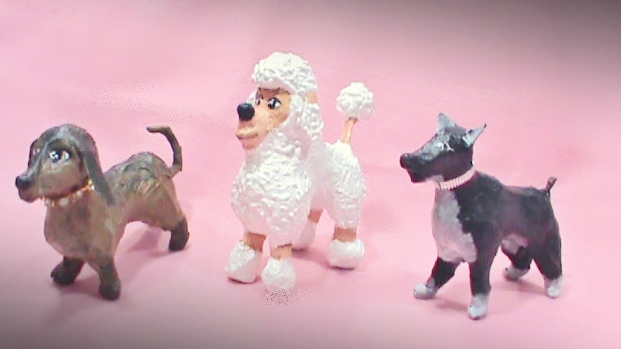 Cachorrinhos em miniatura feito de papietagem